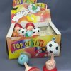WIND UP TOP OF THE WORLD SPINNER